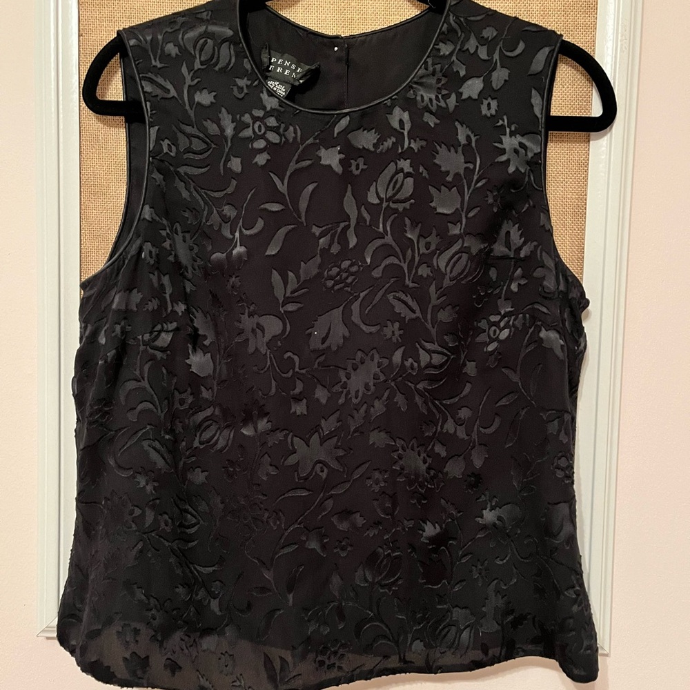 Black Sleeveless blouse with button back. Dressy floral pattern. Size 12.
